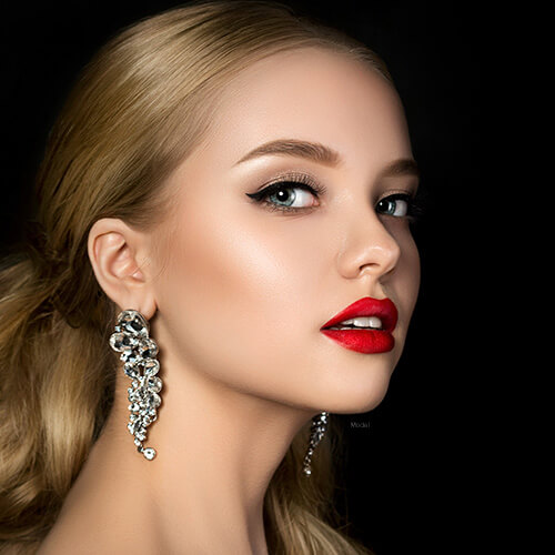 Woman with red lipstick and big earrings